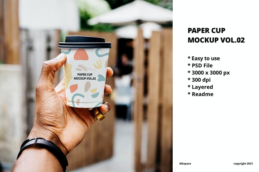 Paper Cup in Hand Mockup PSD