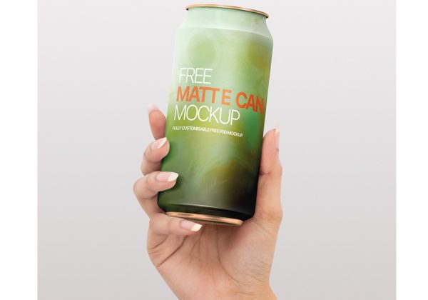 Free Soda Can in Hand Mockup